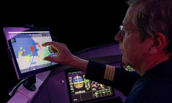 Man operating air traffic management screen